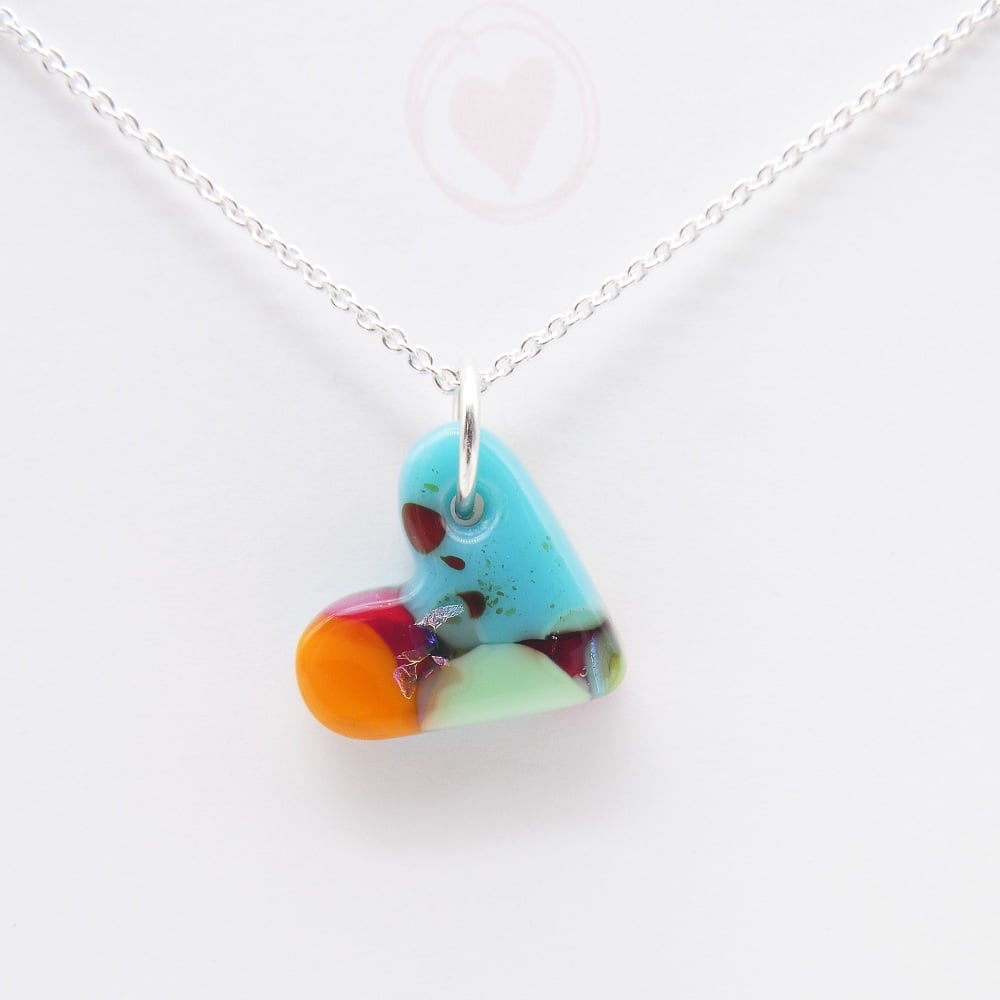 Multicoloured glass heart on silver