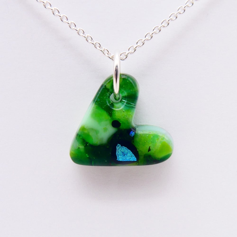 Green glass heart on silver