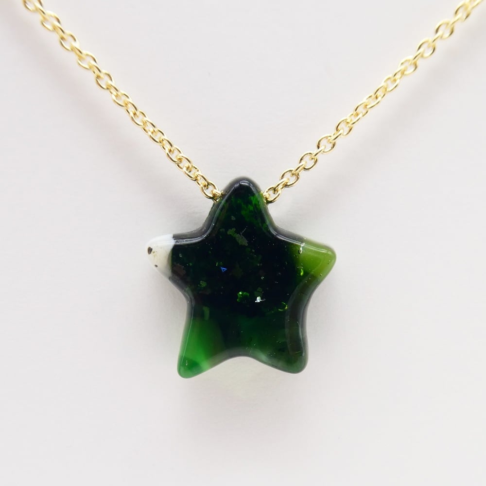 Green Glass star on gold