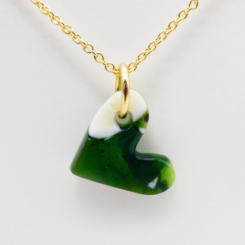 Green glass heart on filled gold