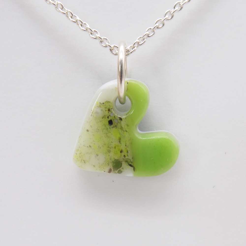 Green and white glass heart on silver