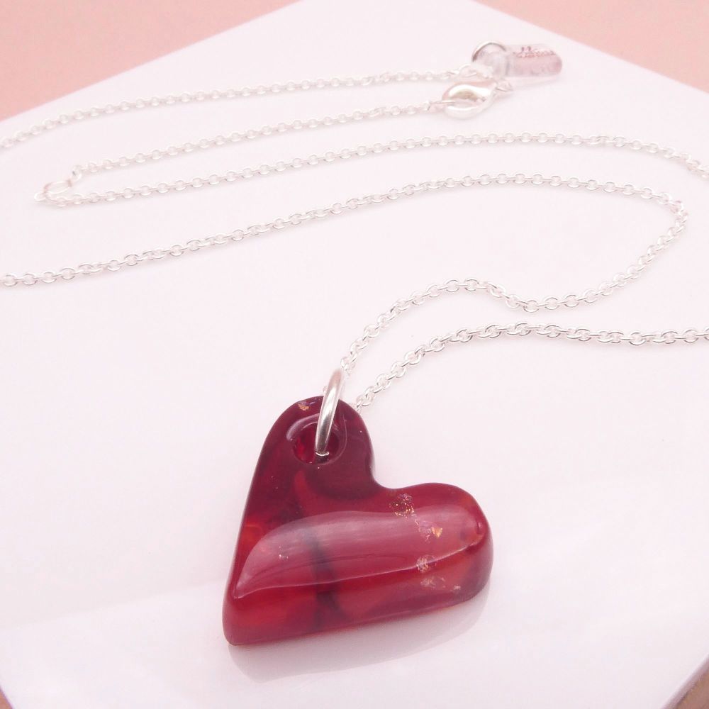 Deep red glass heart on silver 