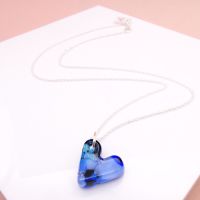 Blue glass heart on silver necklace