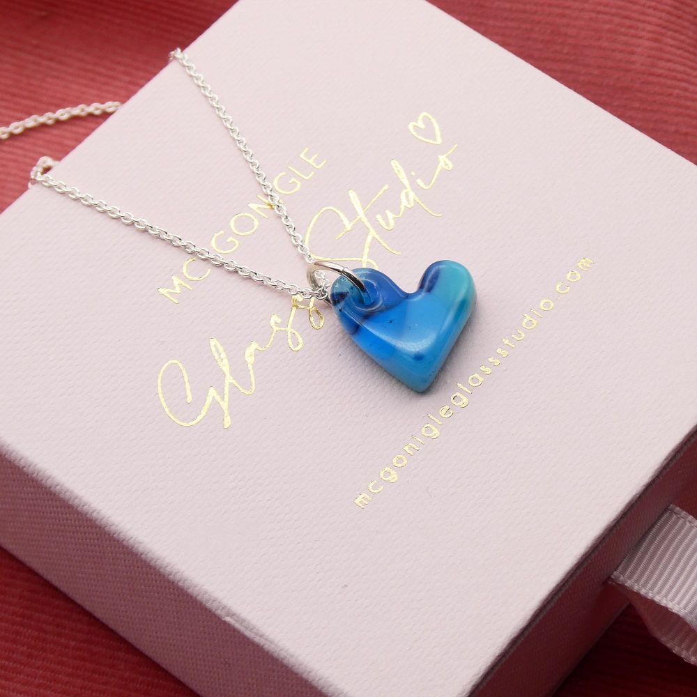 Blue glass heart on silver