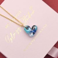 Blue glass heart on a  gold filled necklace
