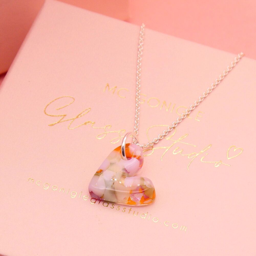 Pastel and orange glass heart on silver