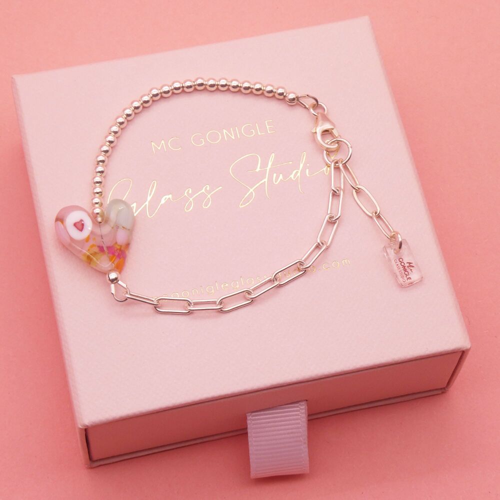 Pastel heart within  heart on a silver Long link bracelet