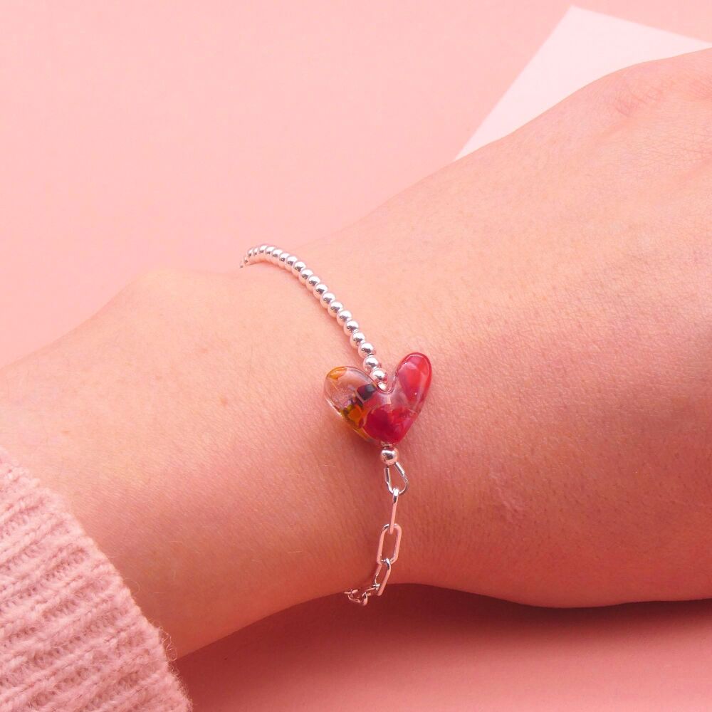 Red and clear glass heart on a silver Long link bracelet