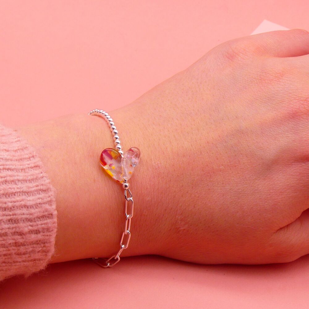 Freckled glass heart on a silver Long link bracelet