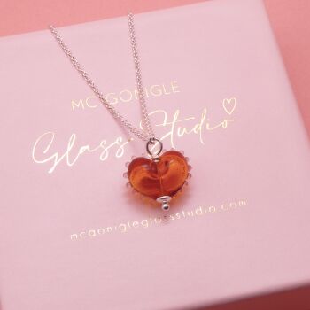 Dotty Amber glass heart on a Silver chain