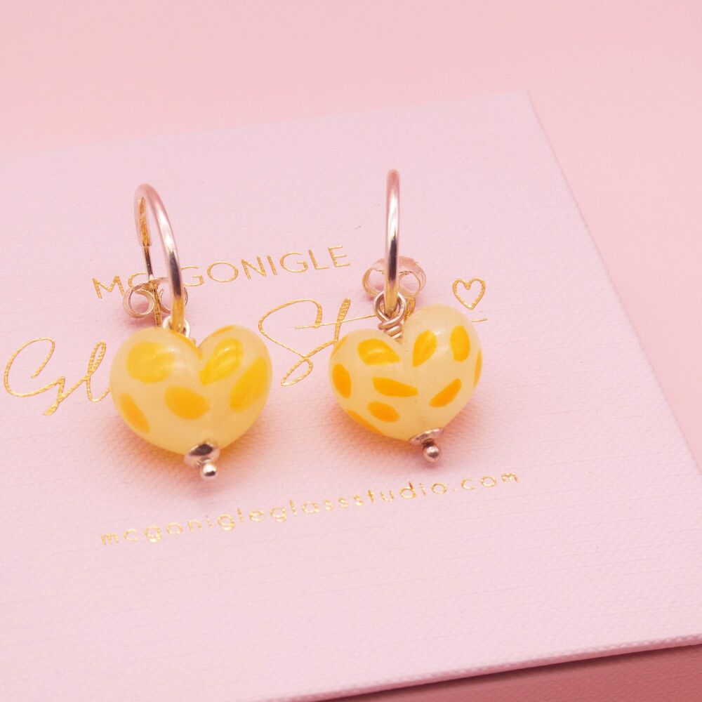 Dotty Yellow glass heart earrings on silver hoops