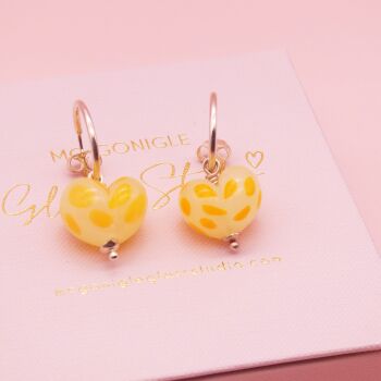 Dotty Yellow glass heart earrings on silver hoops