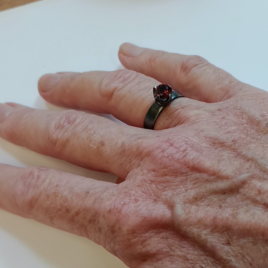 Garnet ring on hand