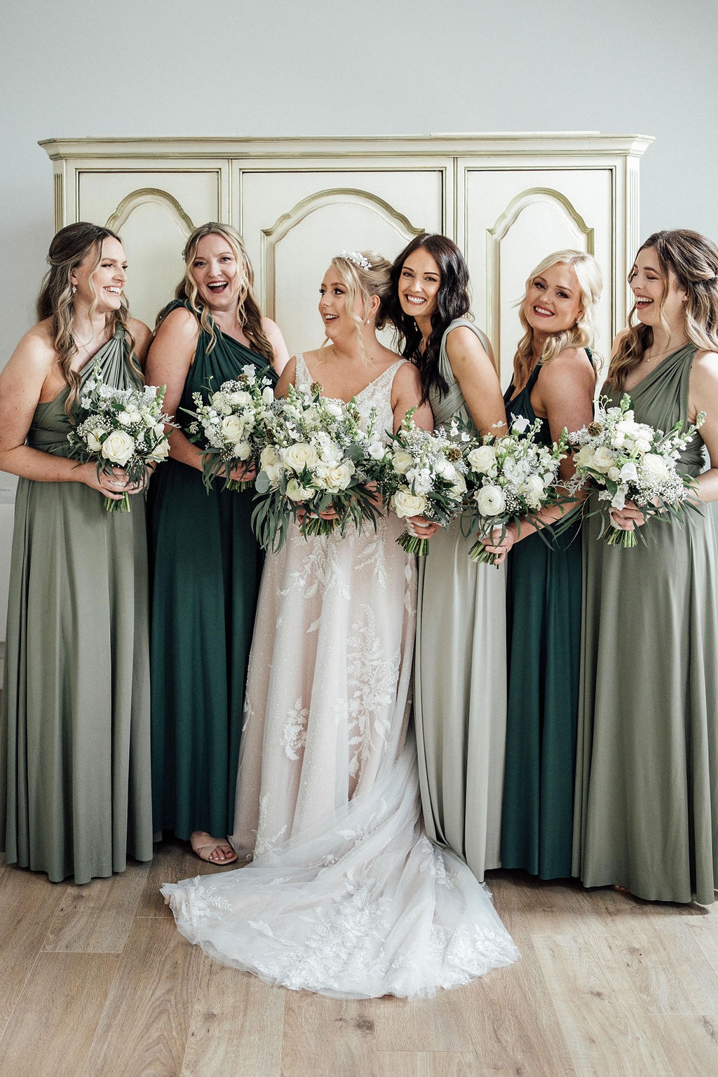 Bride and groom in back of wedding car at Oddhouse Farm