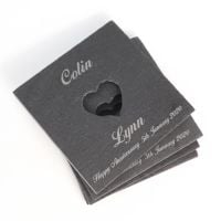Slate coasters with a cut-out heart and personalised