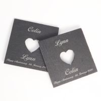 A Pair of Slate coasters with a cut-out heart and personalised