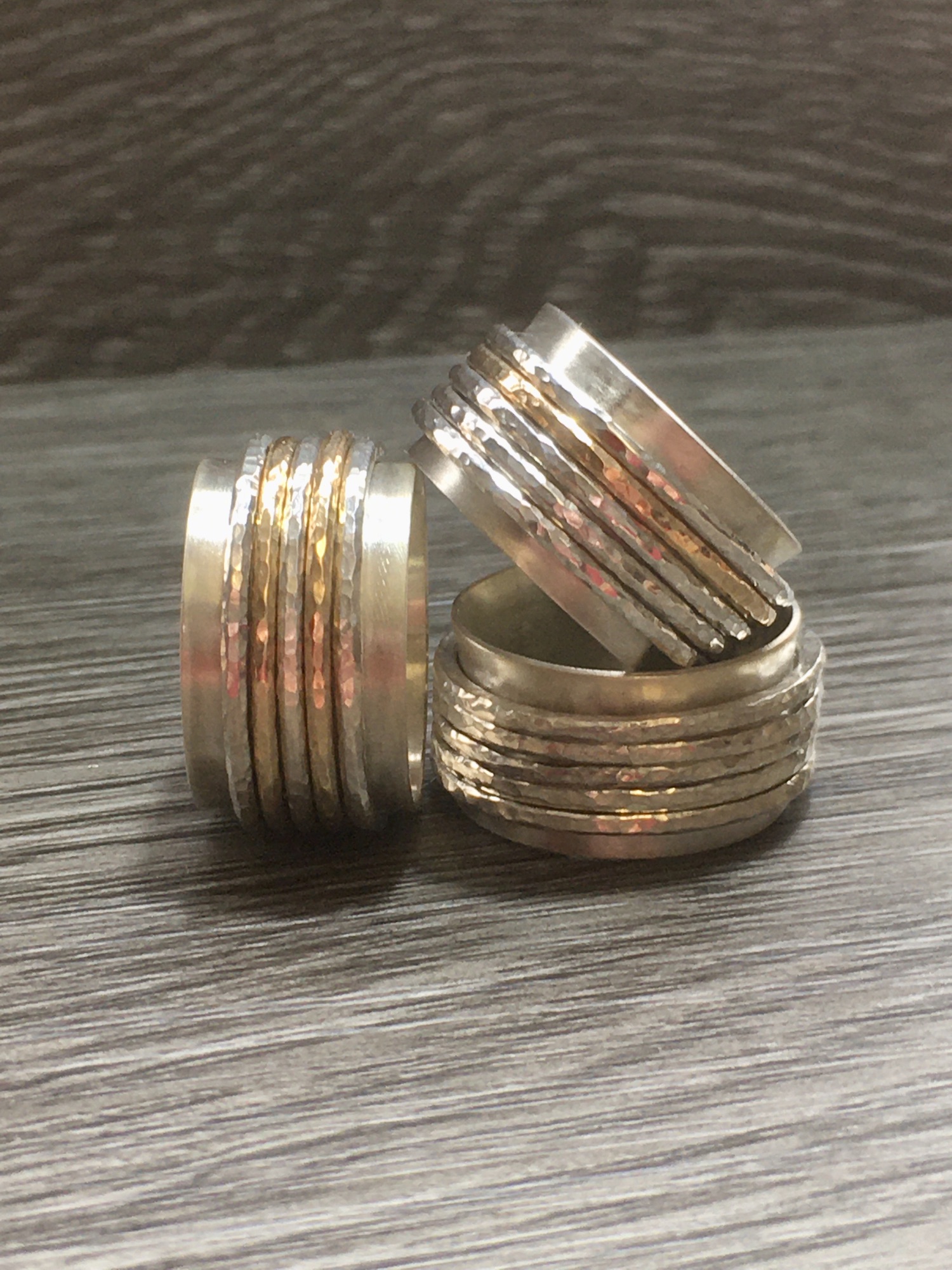 Sterling silver and gold spinner rings