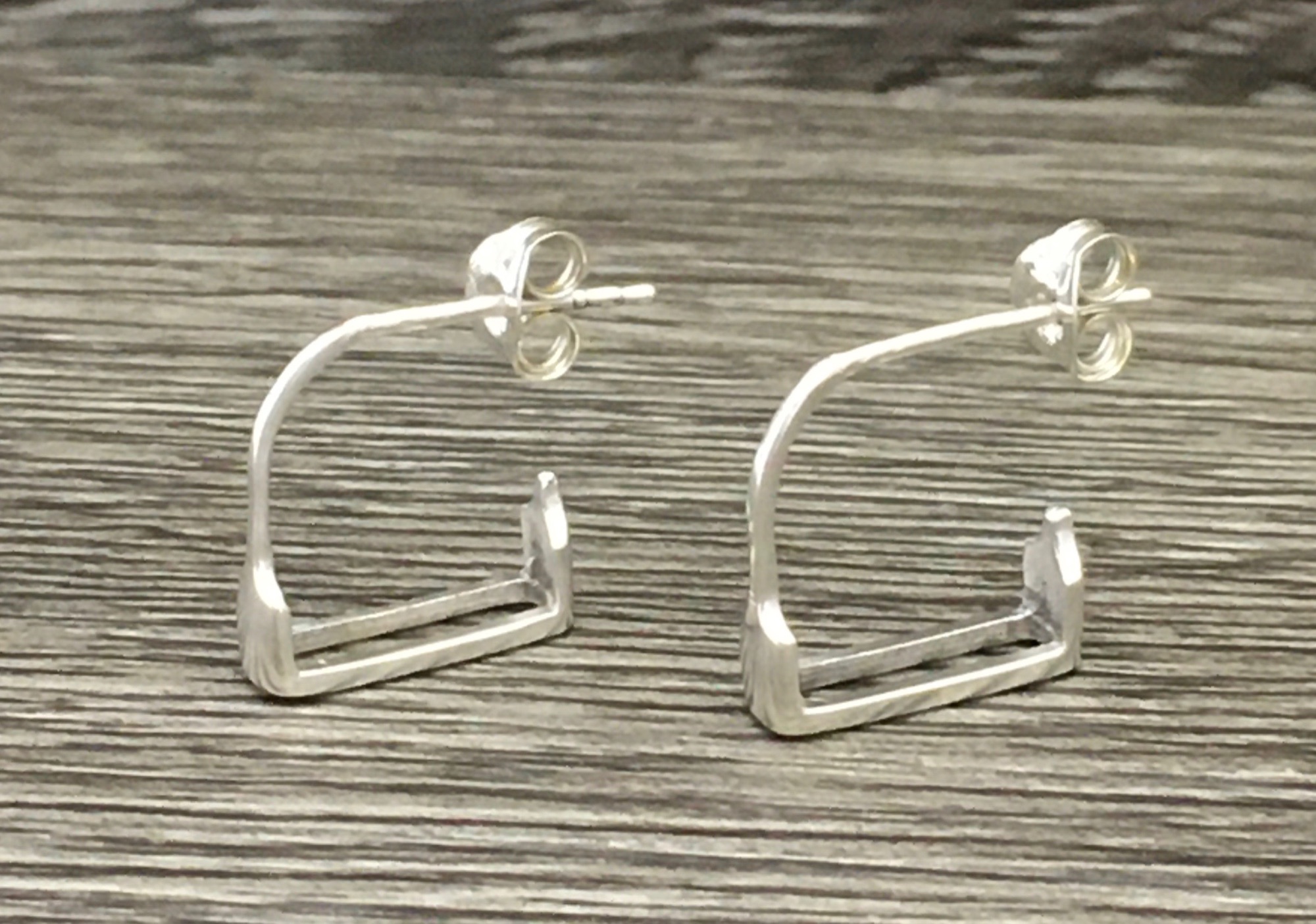 A pair of sterling silver stirrup earrings