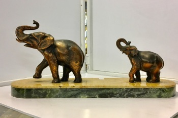 Elephants on marble base