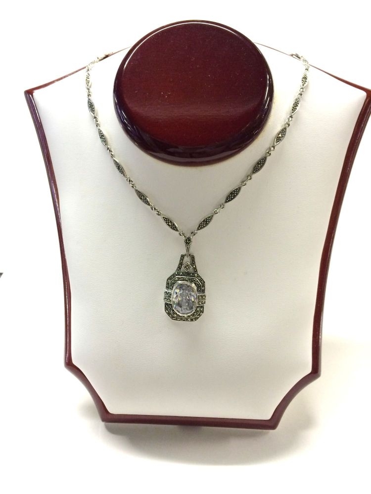 Silver and marcasite necklace with clear central crystal . Art-deco style