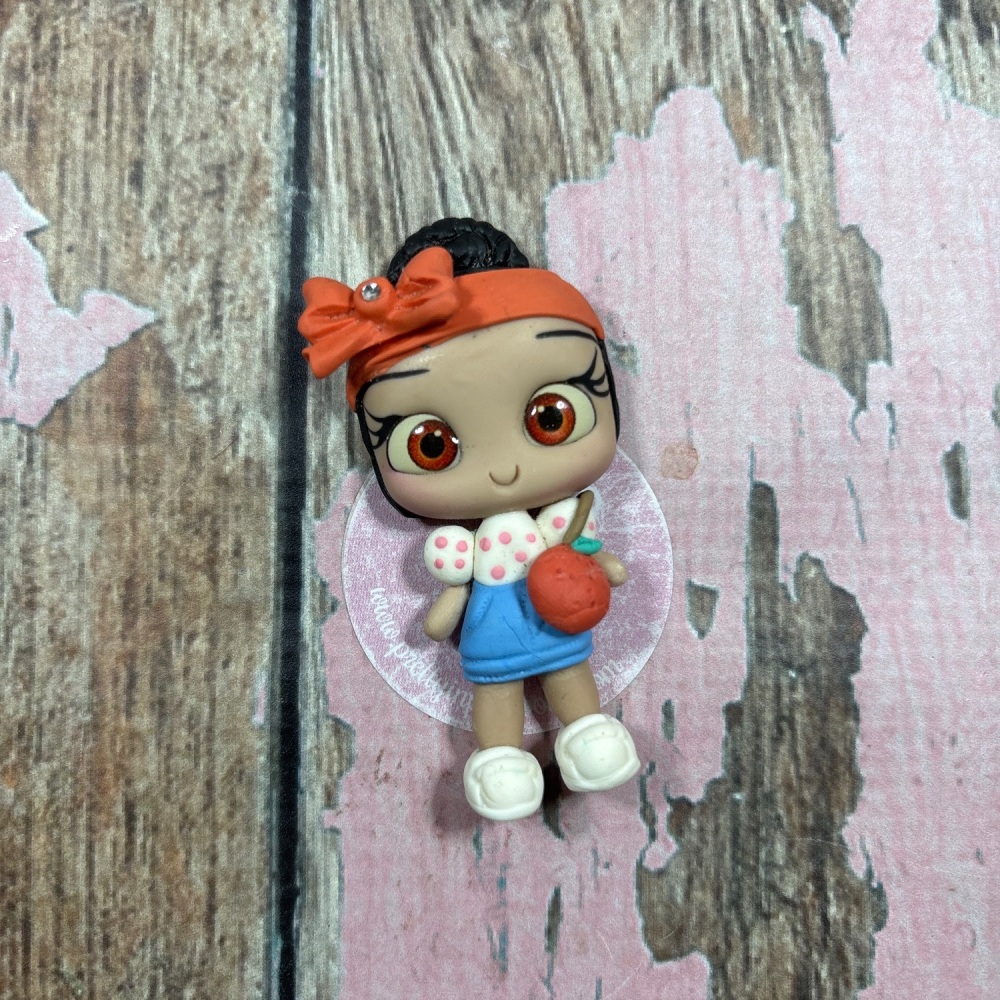 Pink polkadot top blue skirt with orange headband