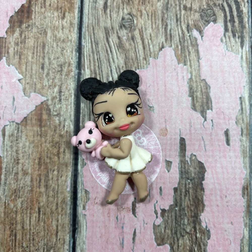 White dress with pink teddy bear black hair brown eyes