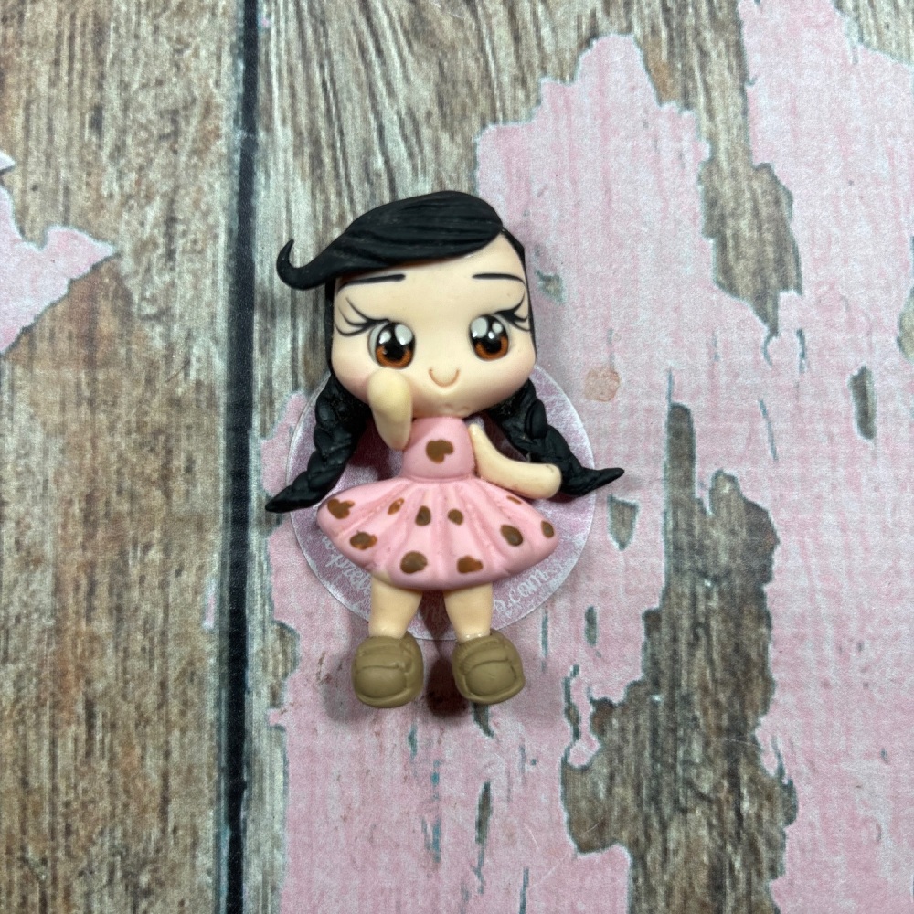Little girl pink dress with brown polkadots black hair brown eyes