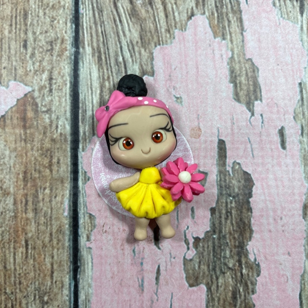 Little girl, yellow dress, pink flower, pink polkadot bandanna, black hair, brown eyes