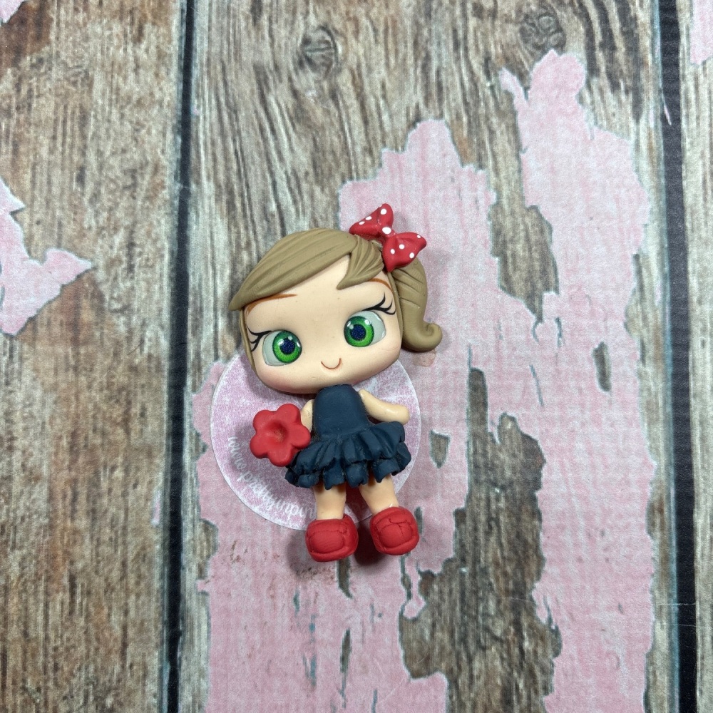 Little girl blue denim RaaRaa dress, red flower red polkadot bow light brown hair, green eyes