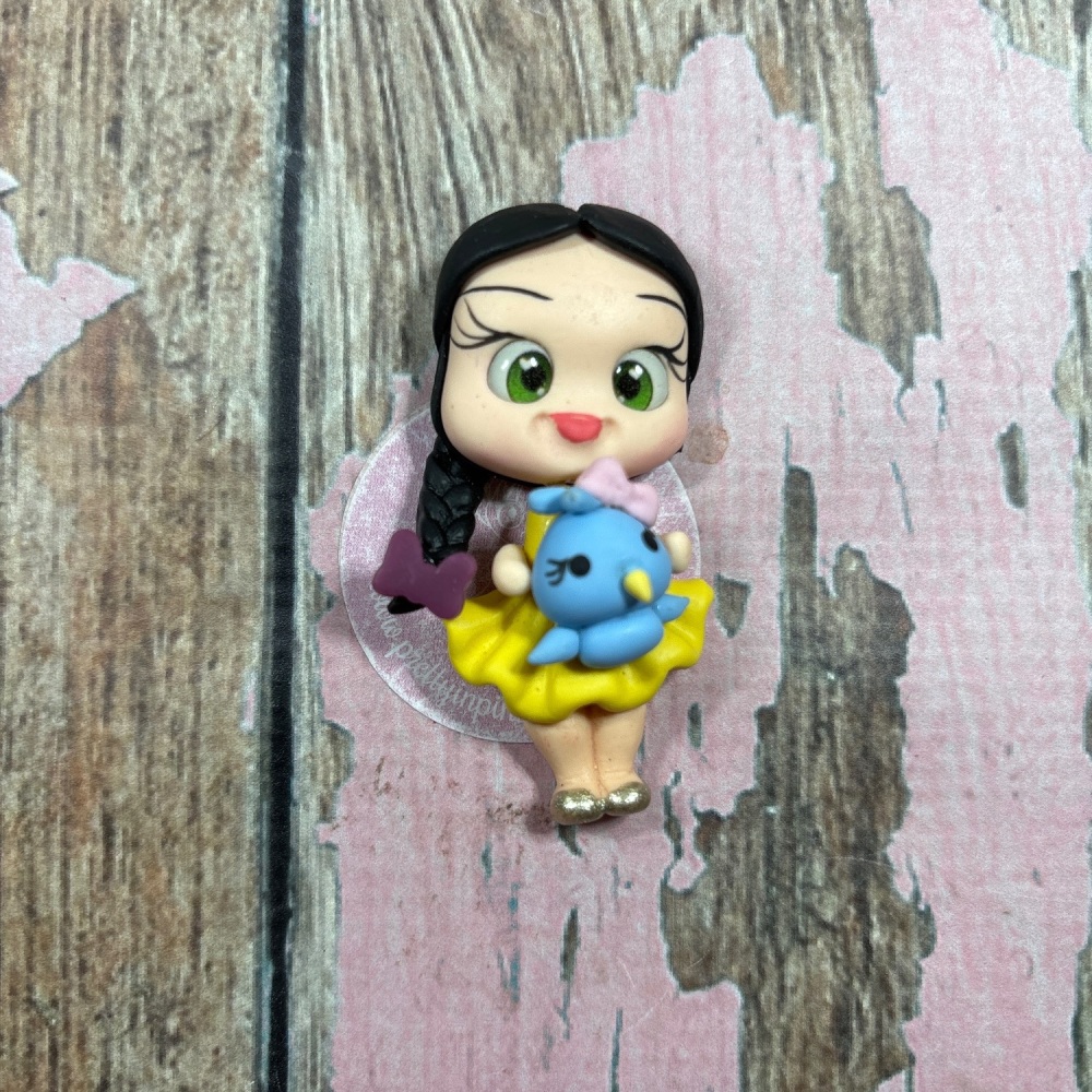 Little girl, yellow dress, bluebird, purple bow, black hair, green eyes