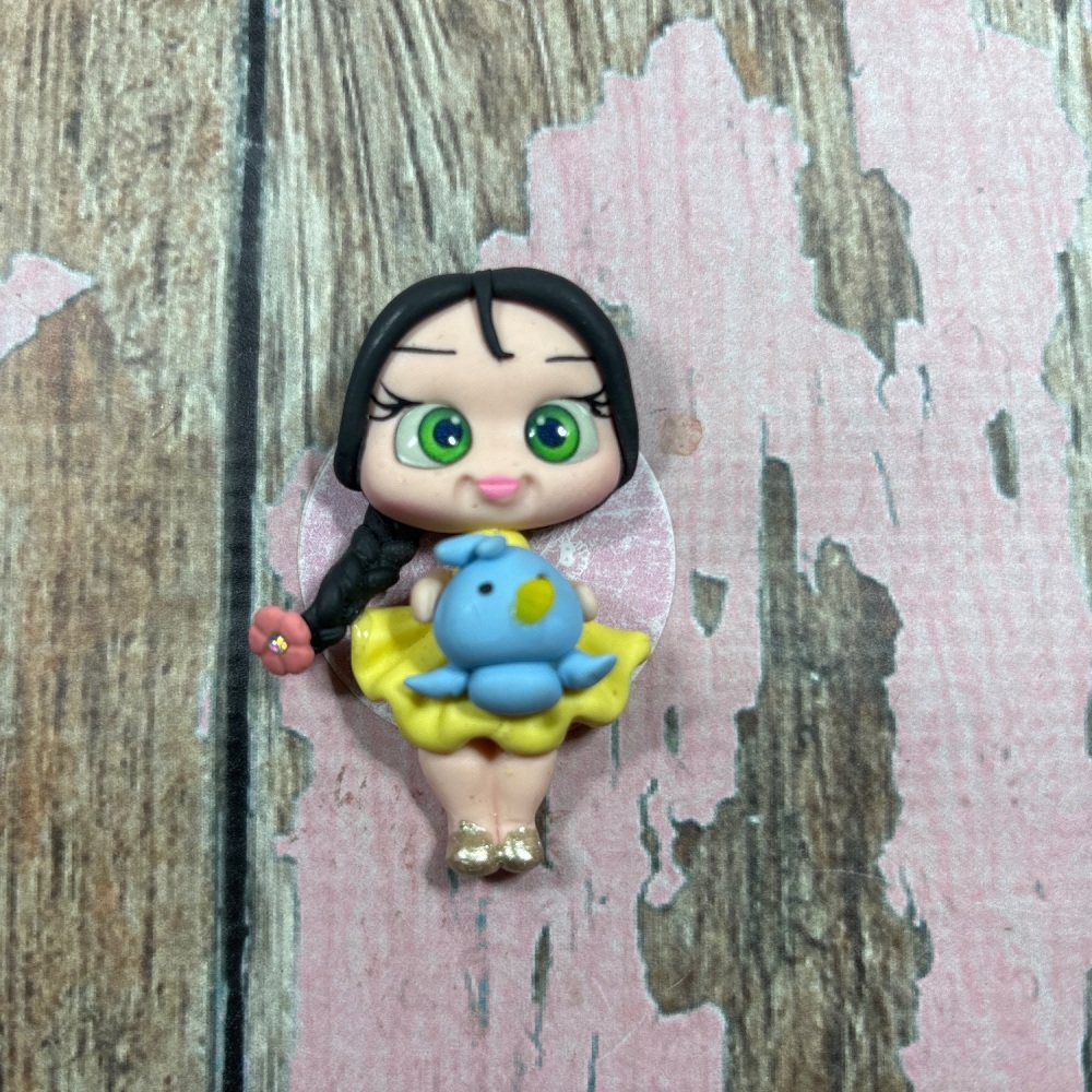 Little girl, yellow dress, bluebird pink flower, black hair, green eyes