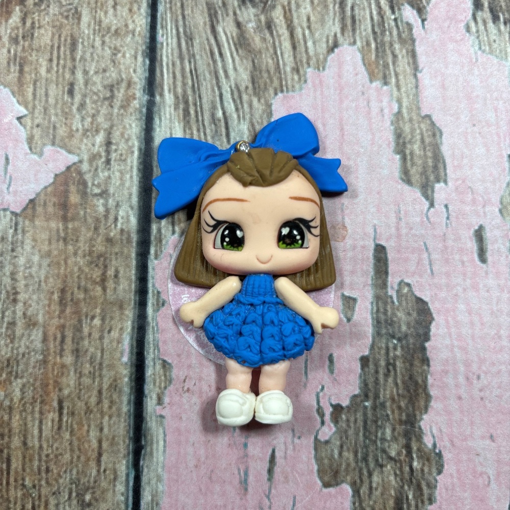 Little girl blue knitted dress, big blue bow light brown hair, green eyes