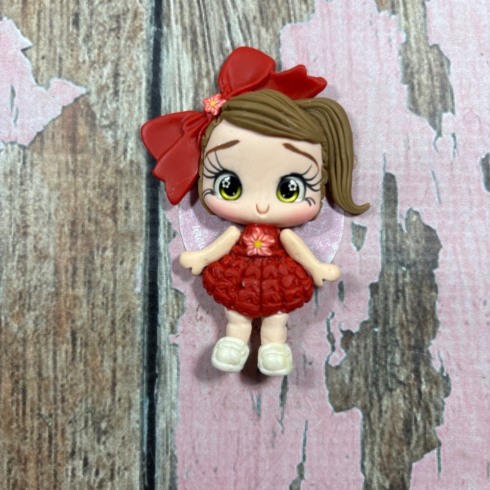 Little girl, red knitted dress, big red bow light brown hair, green eyes