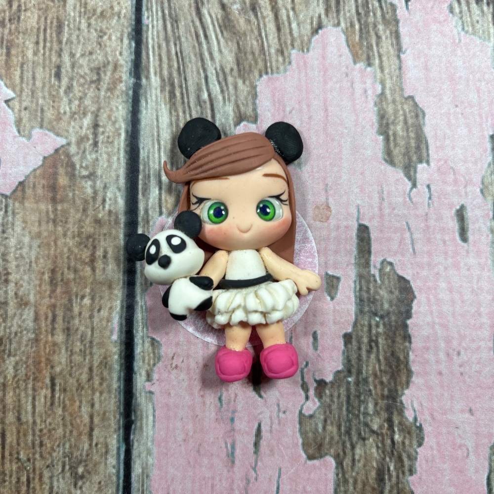 Little girl white dress with panda bear panda ears, brown hair, green eyes