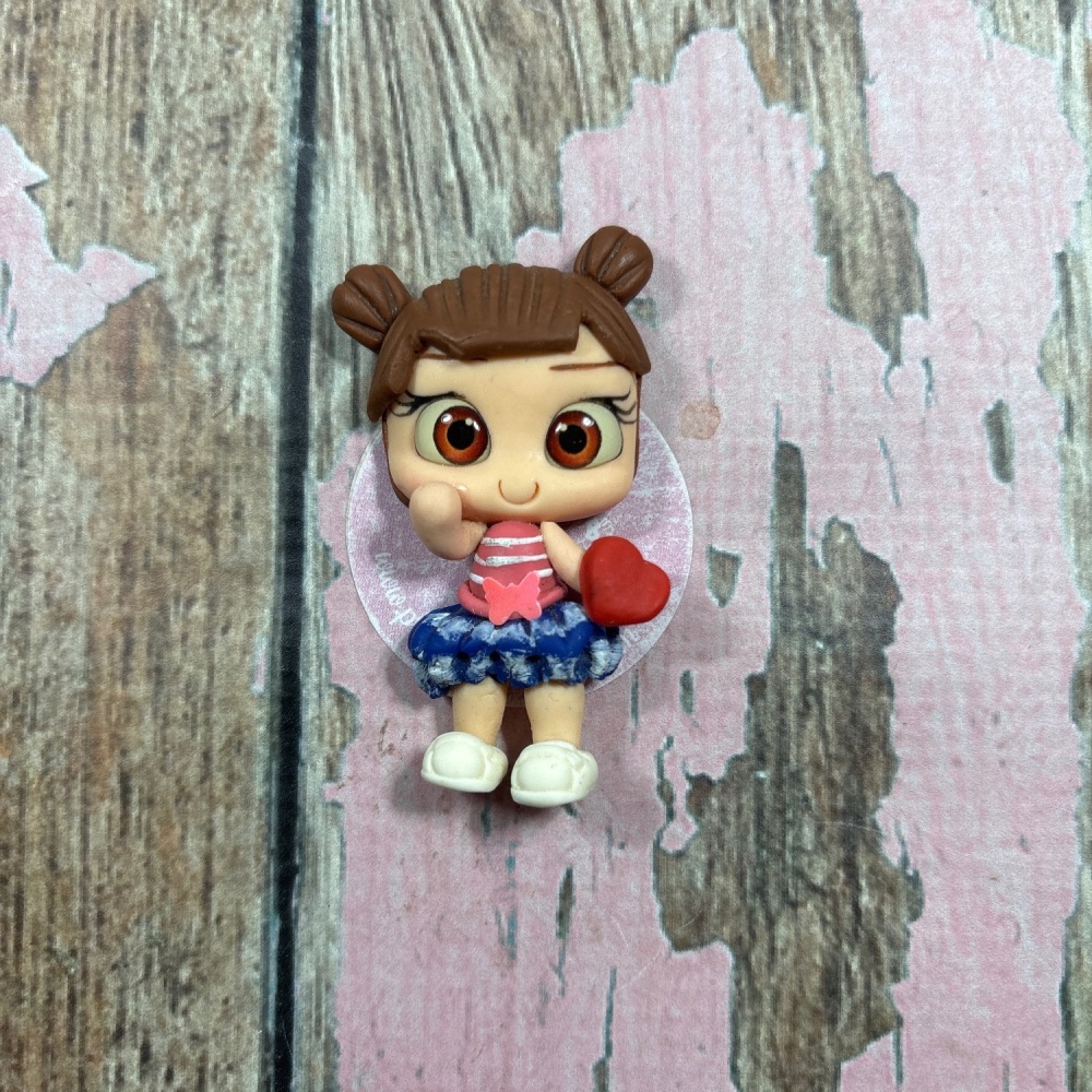 Little girl denim RaaRaa skirt pink top with love heart brown hair, brown eyes