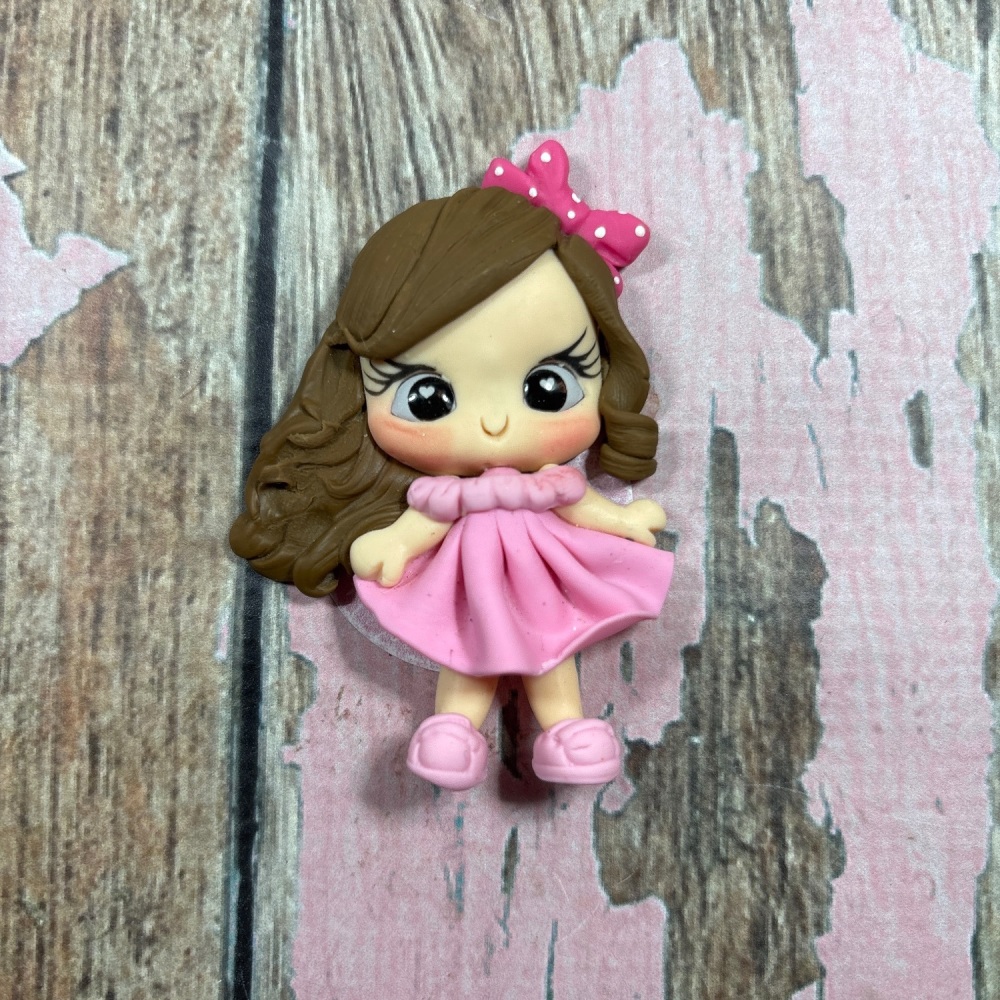 Little girl, pink dress, pink polkadot bow brown hair, brown eyes