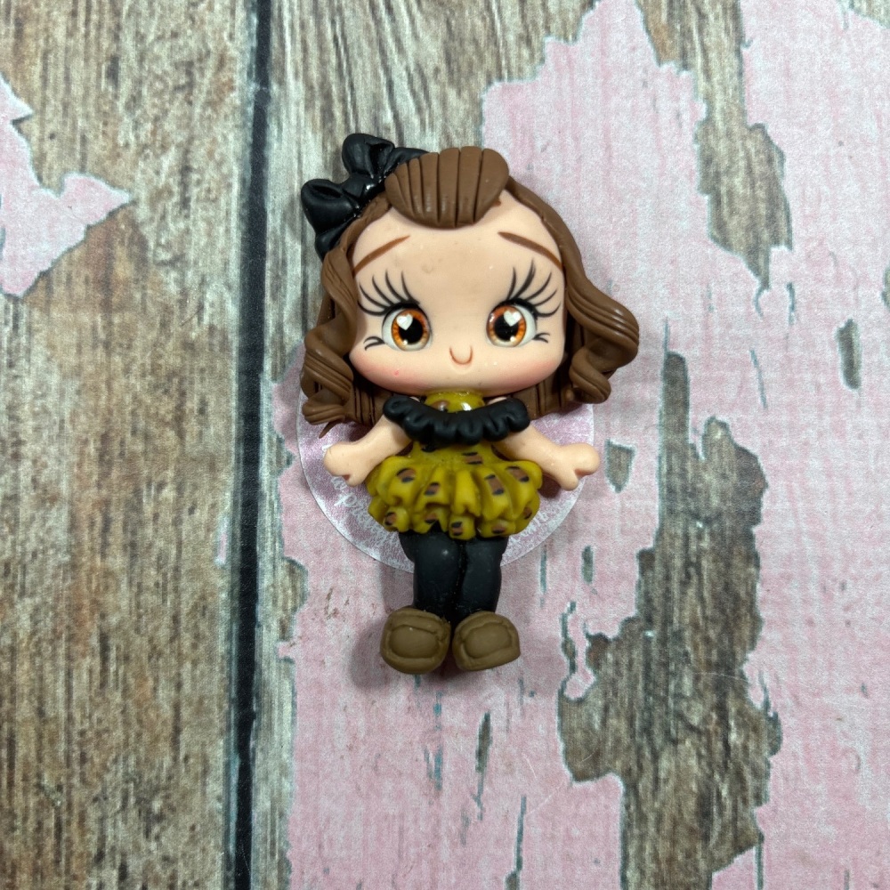 Little girl in leopard print dress, black bow brown hair, brown eyes