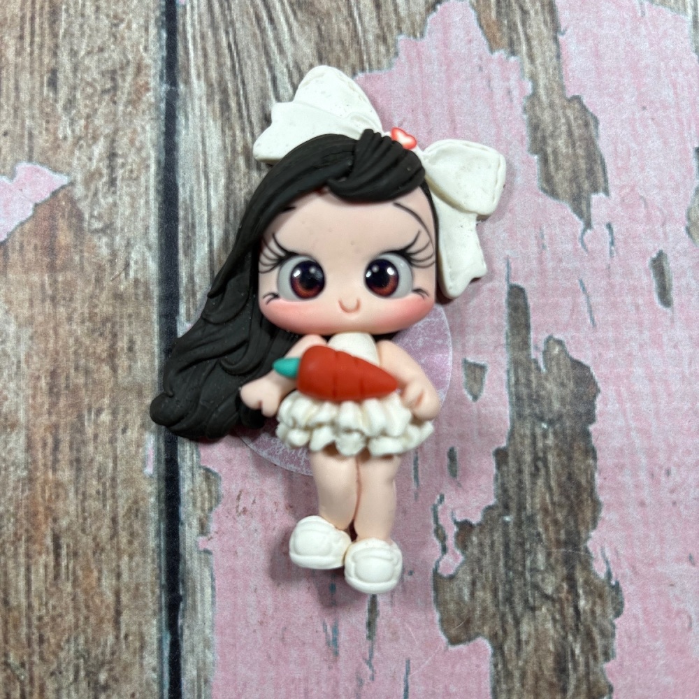 Little girl, white dress, big white bow with carrot, dark brown hair, brown eyes