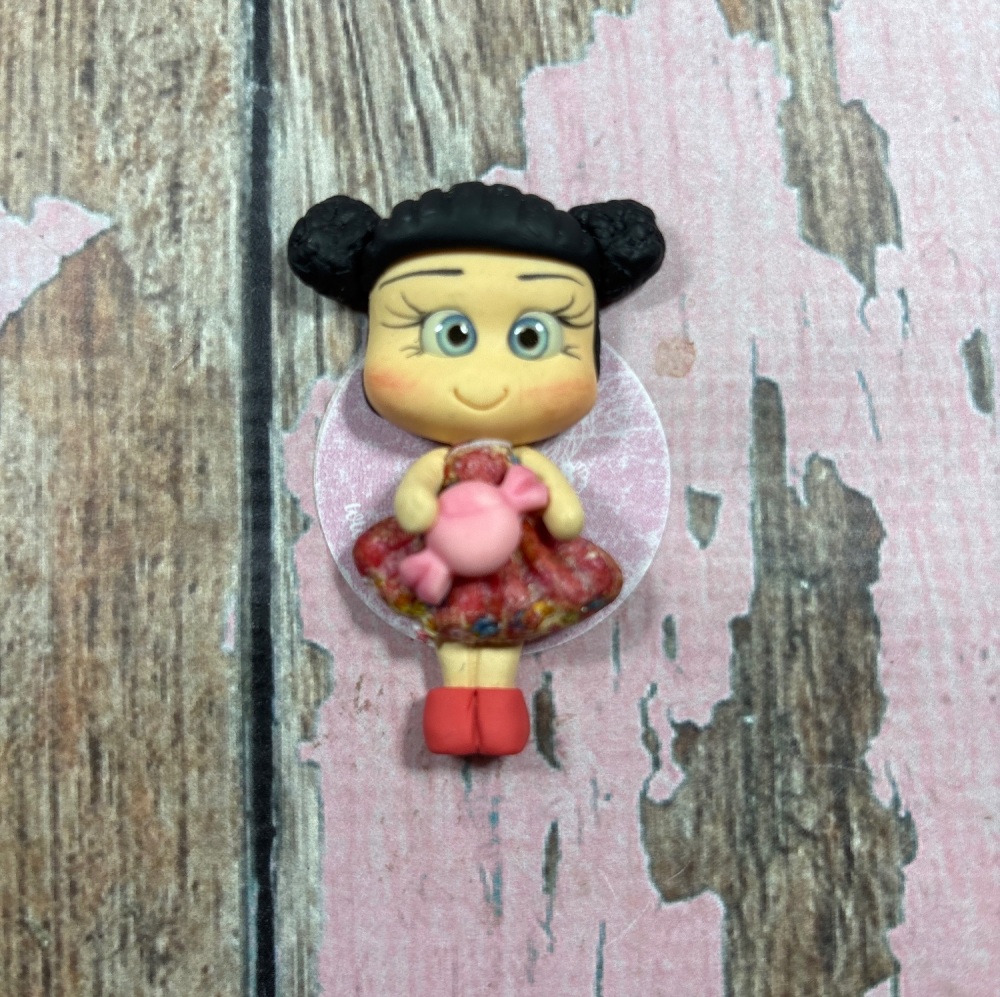 Little girl, multicoloured dress, pink sweet black hair, blue eyes