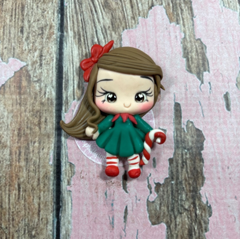 Little girl Christmas dress with candy cane, red bow in hair, brown hair, brown eyes