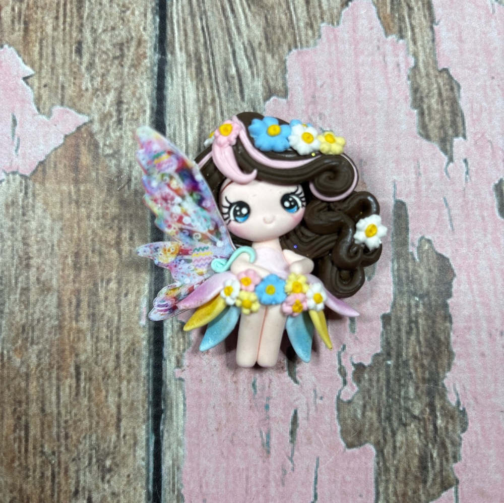 Fairy with pastel pink and brown hair with white blue and yellow daisies in hair