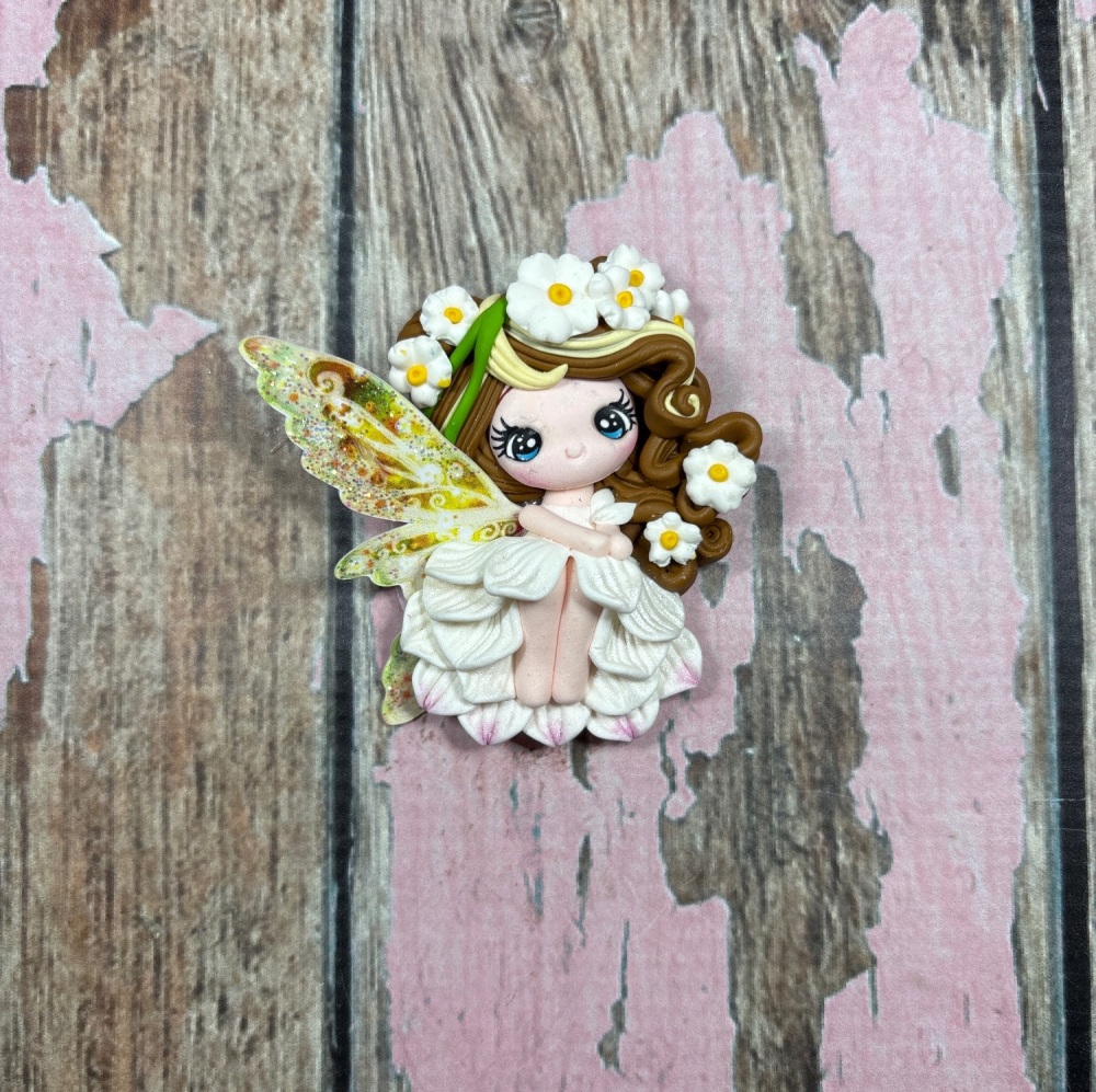 Fairy with white pearl dress, pastel yellow and brown hair with daisies