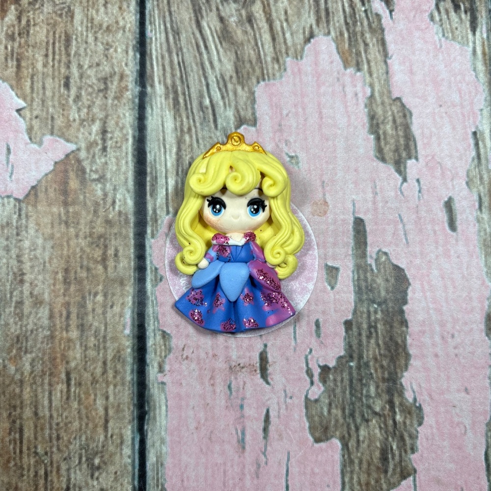 Princess in blue dress with blonde hair and crown