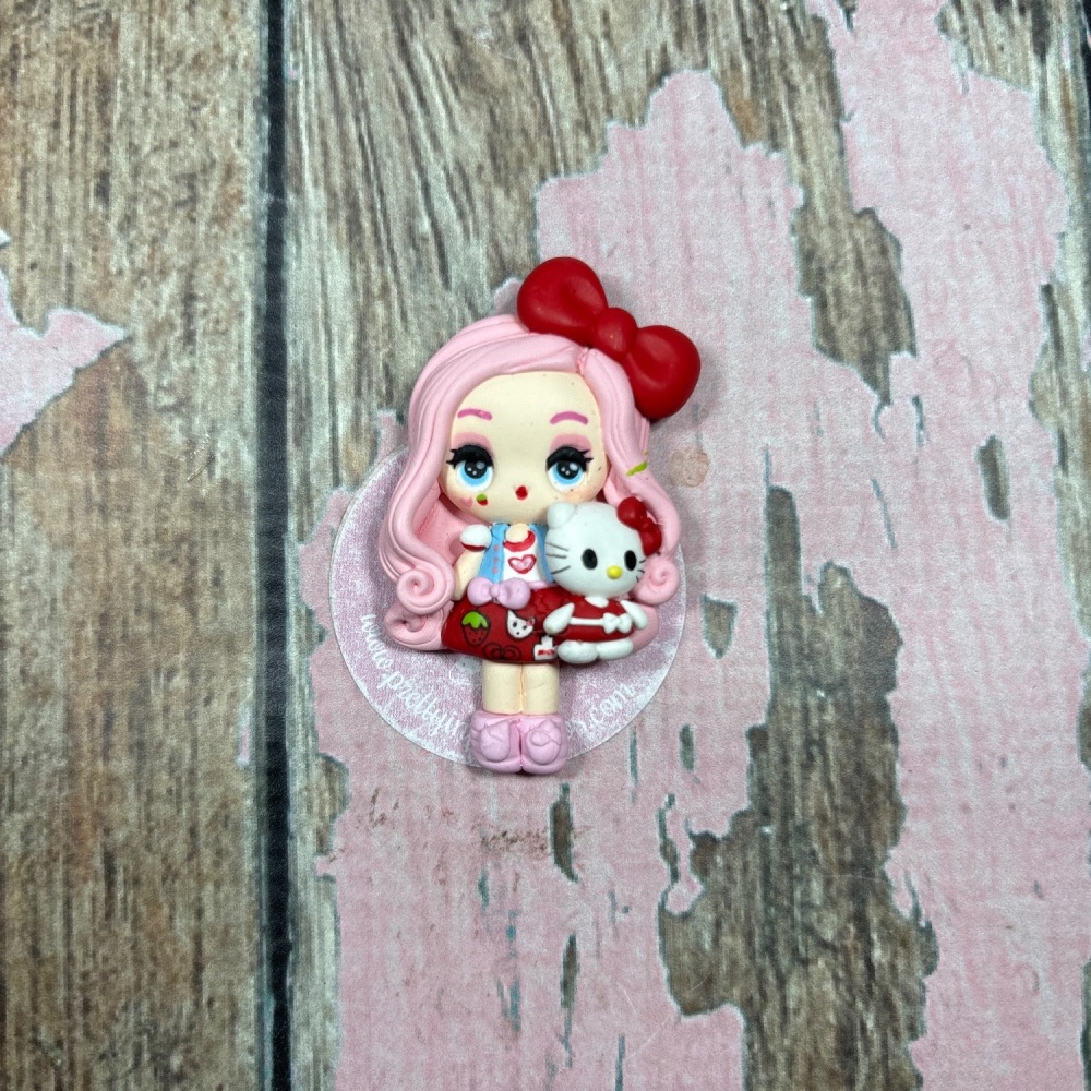 Little girl with hello kitty teddy