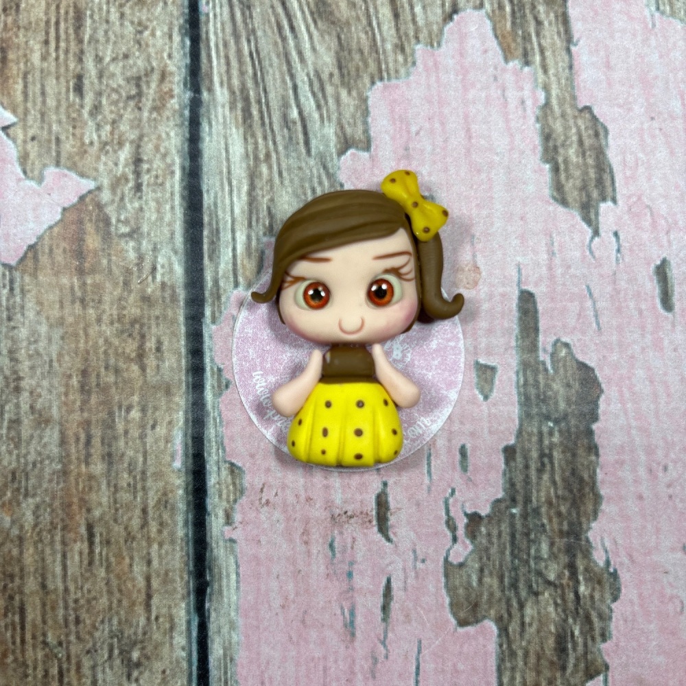 Little girl yellow and brown polka dot dress brow hair