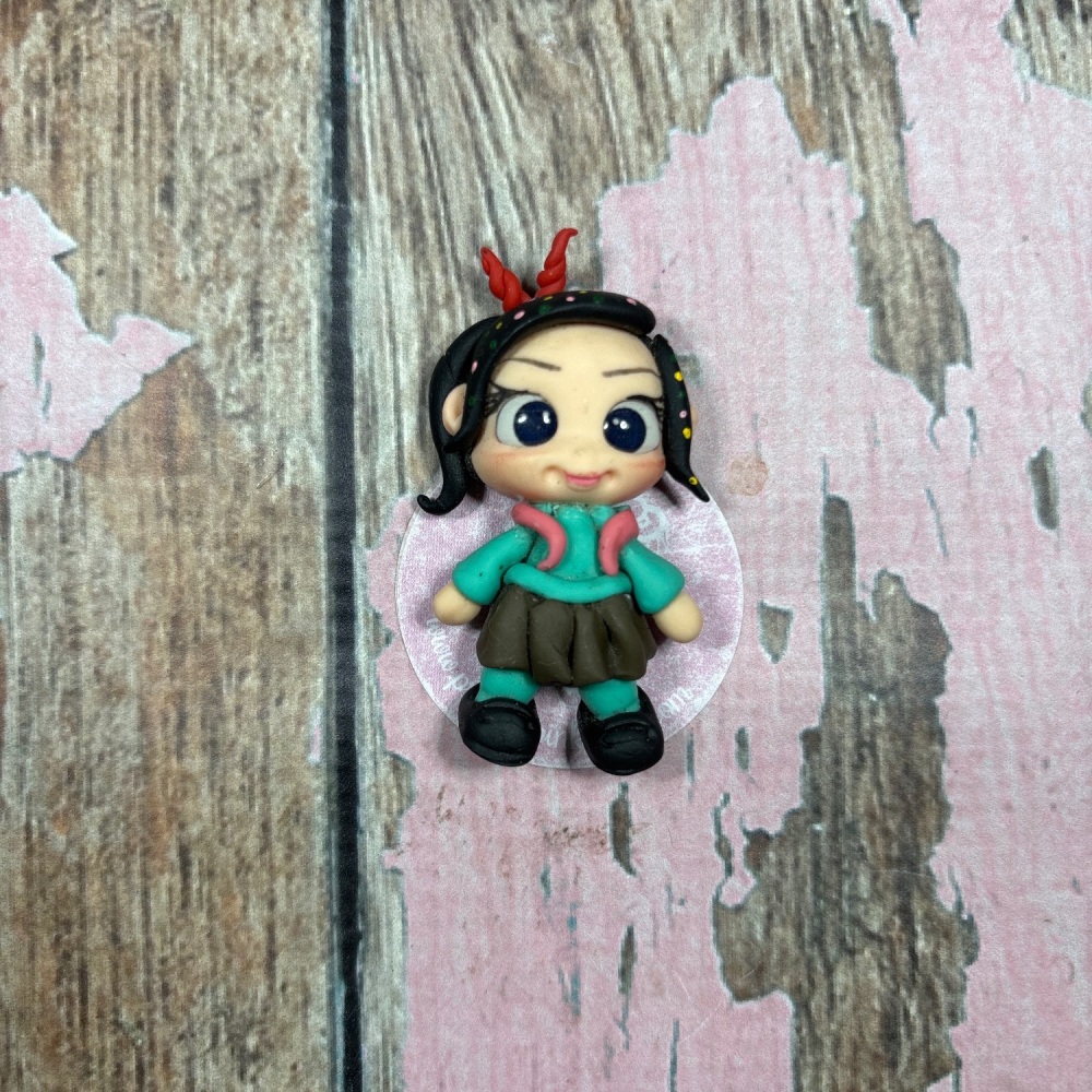Little girl Vanellope Black hair green jacket red bow