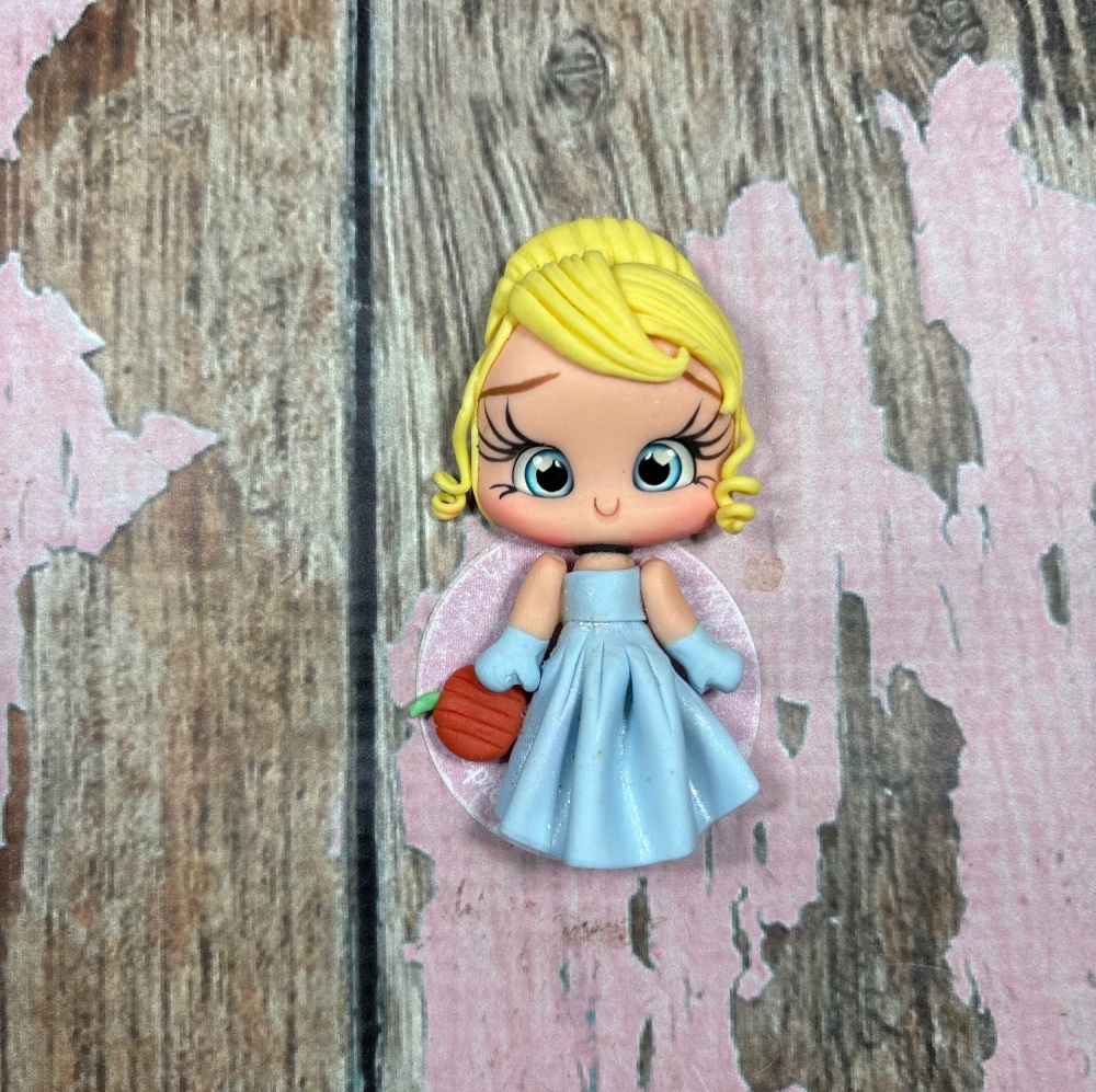 Little Cinderella Blue Dress Yellow hair holding an pumpkin