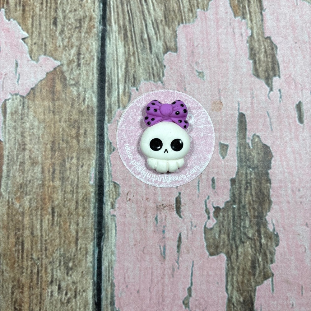 Little skull purple bow with black spots