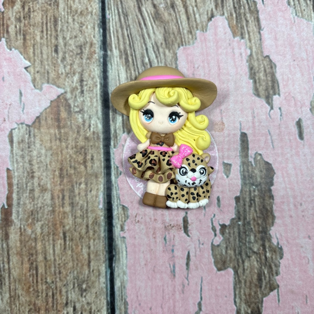 Little Girl Blonde hair leopard print skirt pink bow on leopard