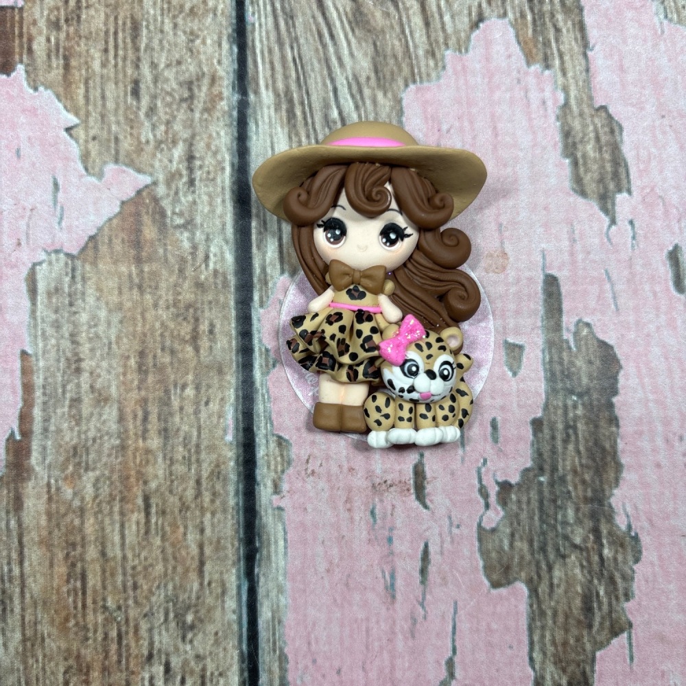 Little Girl Brown hair Leopard print skirt Pink bow on skirt